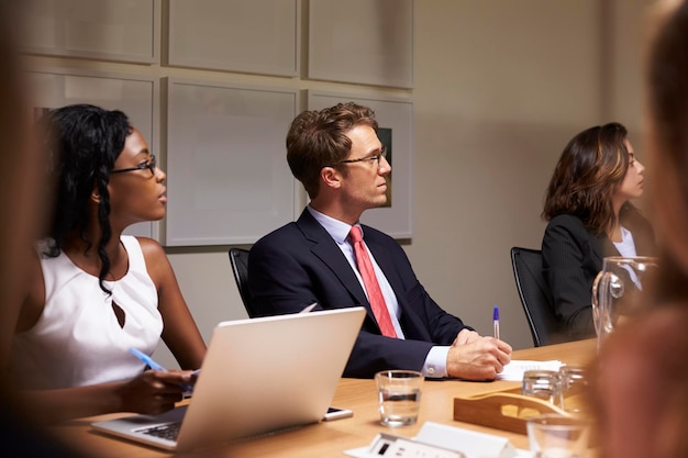 Legal team collaborating on client case strategy and documentation review